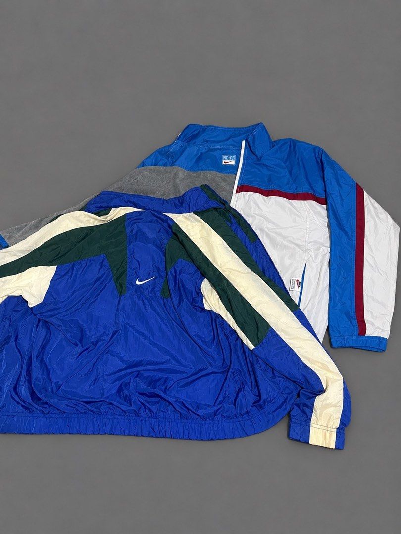 Vintage Nike Windbreaker Track Jacket (Category: Coats, Jackets and Outerwear) located in Manila. Submitted by jelooo_29 (Listing ID 1460337132, Image 1). Description: - Two vintage Nike windbreakers included. - Color 1: Blue, white, and red. - Color 2: Blue, green, and cream. - Both feature the iconic Nike logo. - Perfect for casual wear or athletic activities. - Both are size XL..