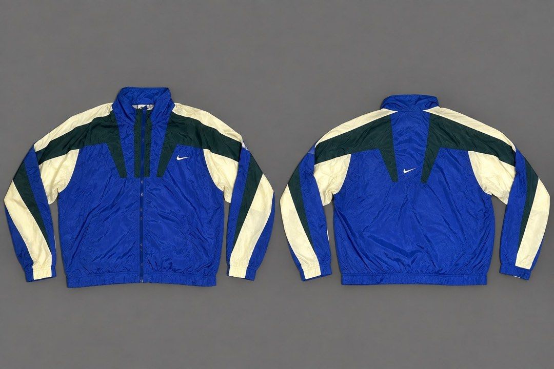 Vintage Nike Windbreaker Track Jacket (Category: Coats, Jackets and Outerwear) located in Manila. Submitted by jelooo_29 (Listing ID 1460337132, Image 2). Description: - Two vintage Nike windbreakers included. - Color 1: Blue, white, and red. - Color 2: Blue, green, and cream. - Both feature the iconic Nike logo. - Perfect for casual wear or athletic activities. - Both are size XL..