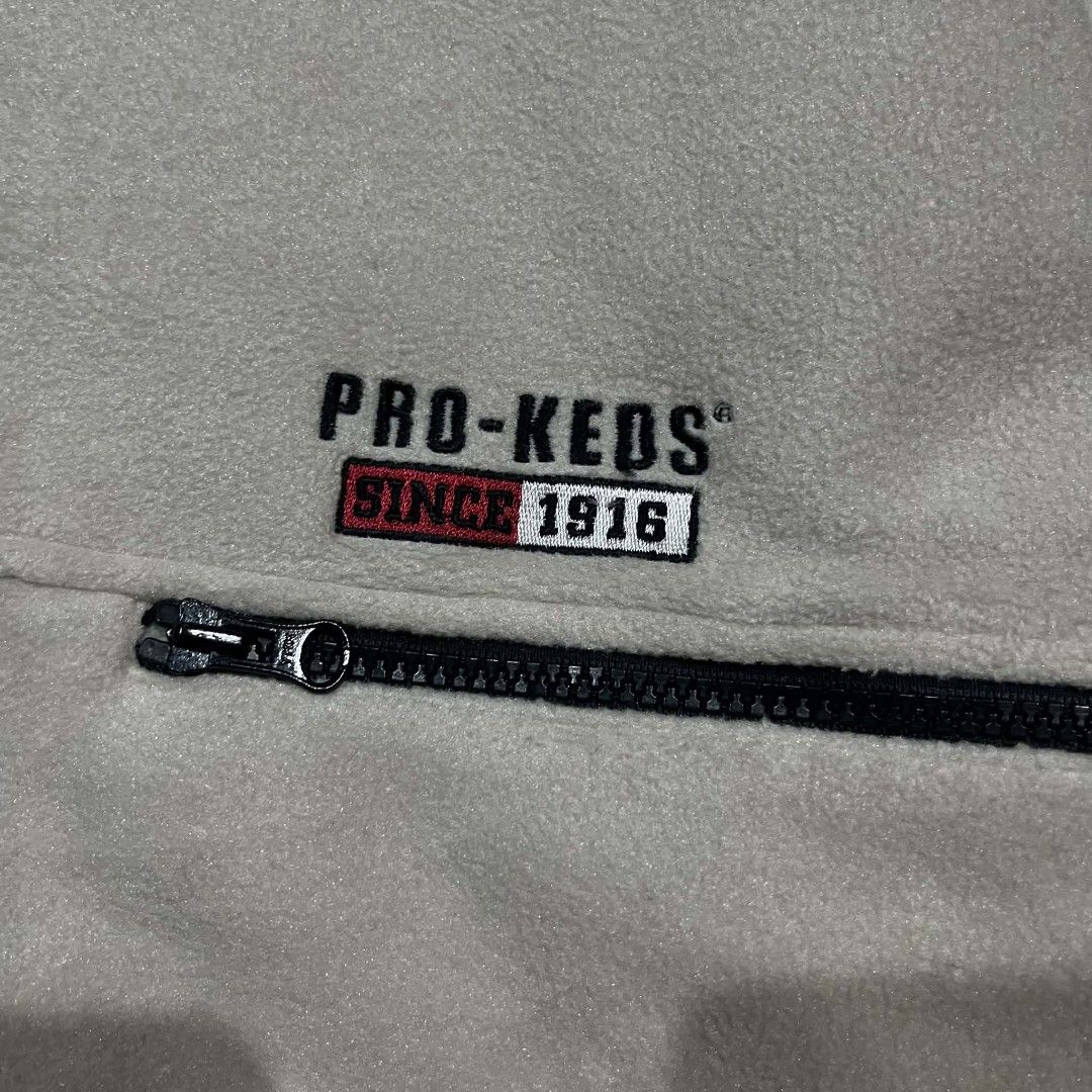 Vintage Pro-Keds Fleece Zip-Up Jacket (Category: Coats, Jackets and Outerwear) located in Pasig City. Submitted by mavsthrift (Listing ID 1460324665, Image 2). Description: - Cream-colored Pro-Keds fleece jacket - Size: 4L - Full zip closure - Black collar and trim - Two side pockets with zip closures - Embroidered Pro-Keds logo on chest -Dimes: 29" × 32" fit to L/XL - Condition: 8/10 Note: Shipping fee is additional. Feel free to ask! Ship via J