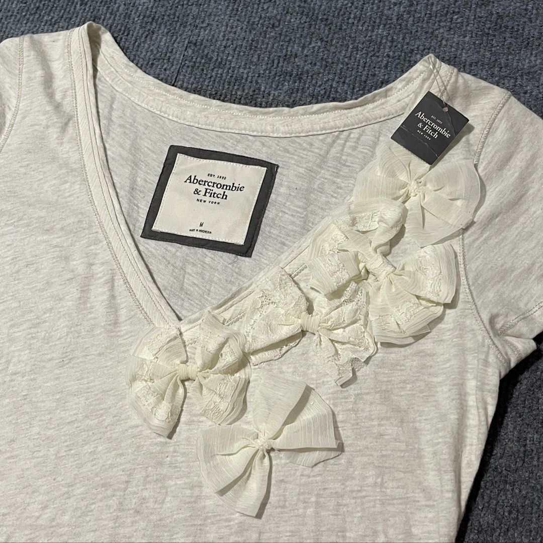 abercrombie & fitch 2000 top (Category: Others Tops) located in Malay. Submitted by oplt_dept. (Listing ID 1460419428, Image 3). Description: -Brandnew condition (with tag) -vintage y2k essentials -size:medium -width:18 -length:29 -made in indonesia .
