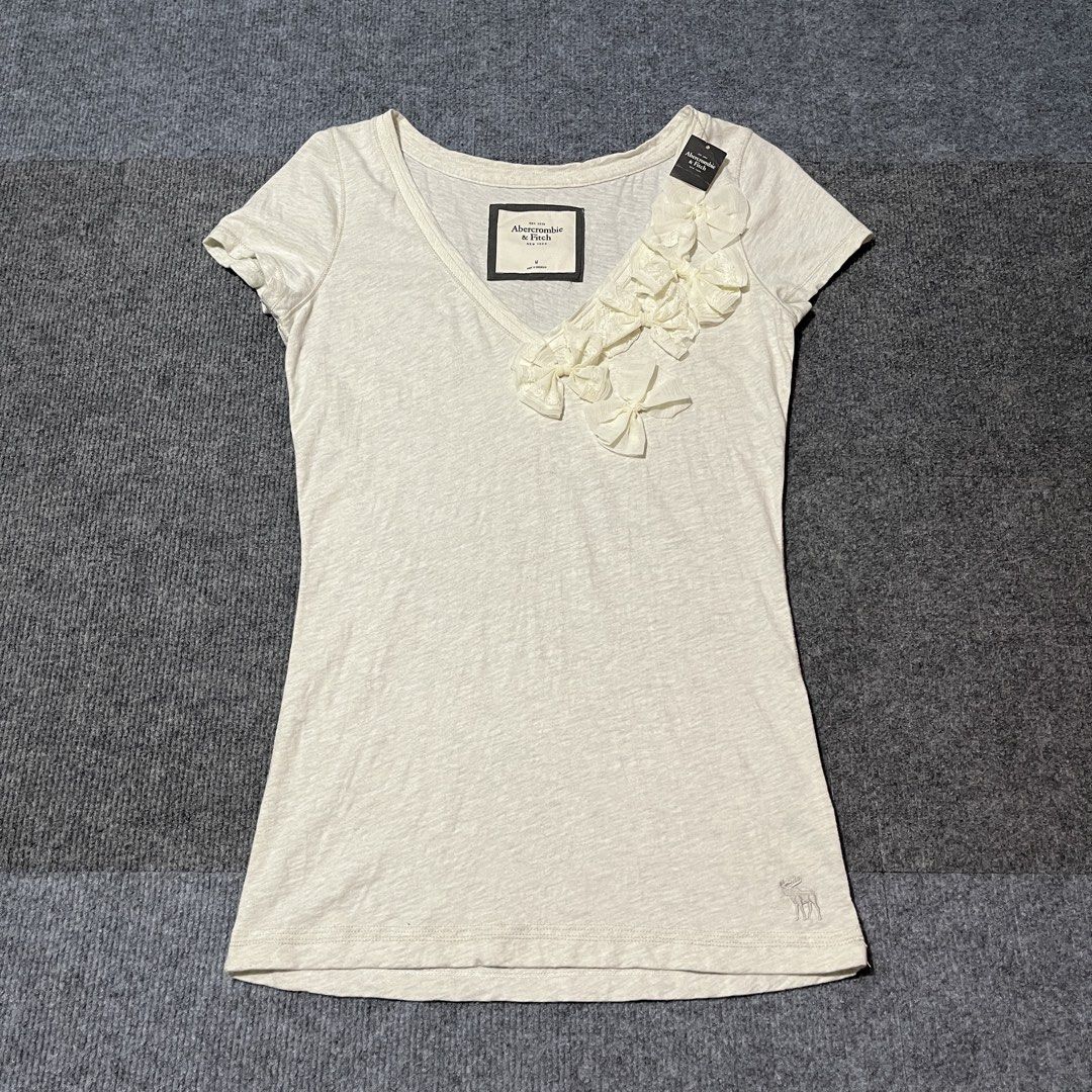 abercrombie & fitch 2000 top (Category: Others Tops) located in Malay. Submitted by oplt_dept. (Listing ID 1460419428, Image 1). Description: -Brandnew condition (with tag) -vintage y2k essentials -size:medium -width:18 -length:29 -made in indonesia .