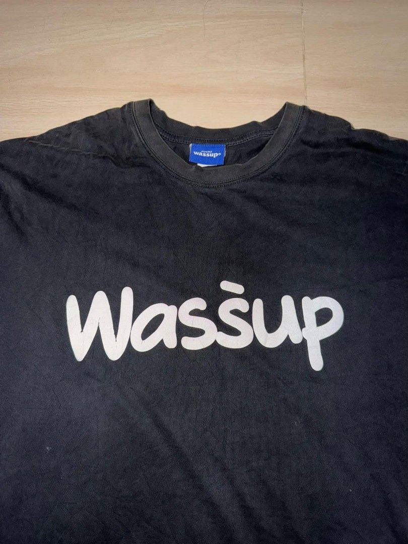 Wassup Black Graphic T-shirt (Category: Tshirts & Polo Shirts ) located in Cainta. Submitted by hermosooo (Listing ID 1460432240, Image 2). Description: - Classic black t-shirt - Features a 'Wassup' graphic print in white - Short sleeves and crew neck design - Ideal for comfortable, everyday casual wear.