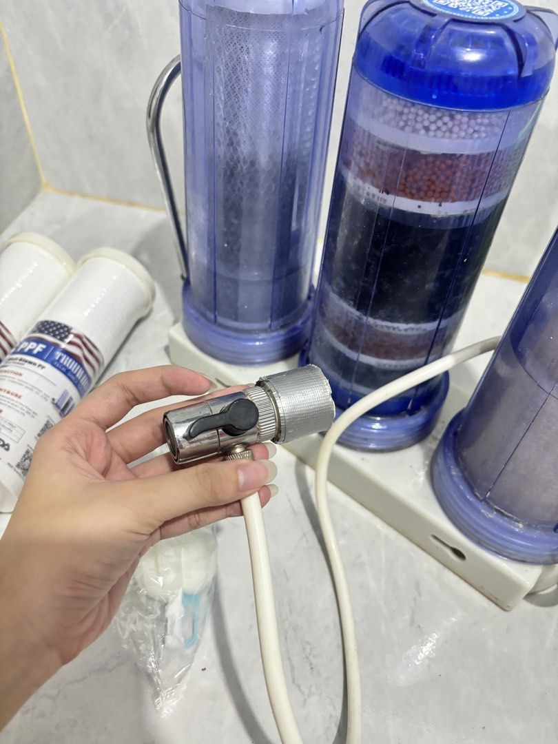 Water Filter (Category: Water Purifiers & Dispensers) located in Quezon City. Submitted by sopiiyyaa (Listing ID 1460454172, Image 2). Description: PRICE IS NEGOTIABLE IF SURE BUYER!! - may kasama 2 clean filter pls read po: di pa napapalitan ng filter since nabili. nilagyan lang tape sa may faucet kasi natatanggal siya pag sobrang lakas ng tubig pero pwede i-screw. .