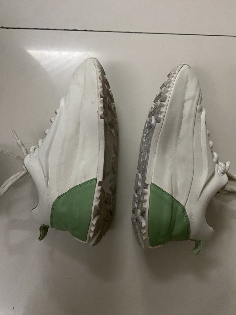 White and Green Chunky Sneakers (Category: Sneakers) located in Imus. Submitted by 9teen.87 (Listing ID 1460461645, Image 1). Description: UNISEX size 42 -White sneakers with stylish green accents - Classic lace-up closure - Trendy chunky sole design - Visible brand logo on insole - Shows minor dirt on soles from normal wear - Perfect for everyday casual wear.