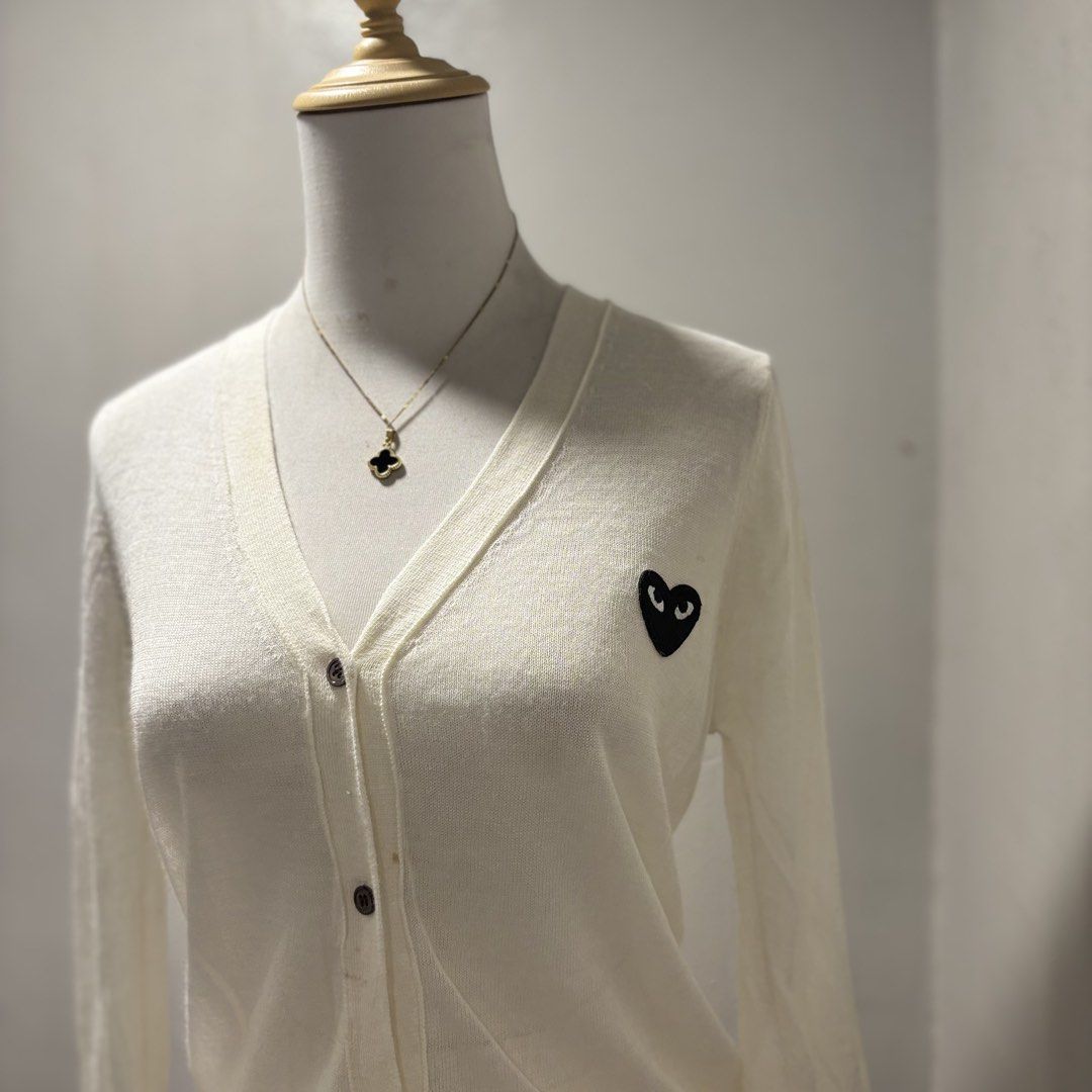 White Cardigan with Black Heart Logo (Category: Coats, Jackets and Outerwear) located in Mandaluyong City. Submitted by shopwithjuu (Listing ID 1460347344, Image 2). Description: Comme des Garçons Play white long-sleeved cardigan with iconic black heart logo. Button-up, lightweight knit. Perfect for layering..