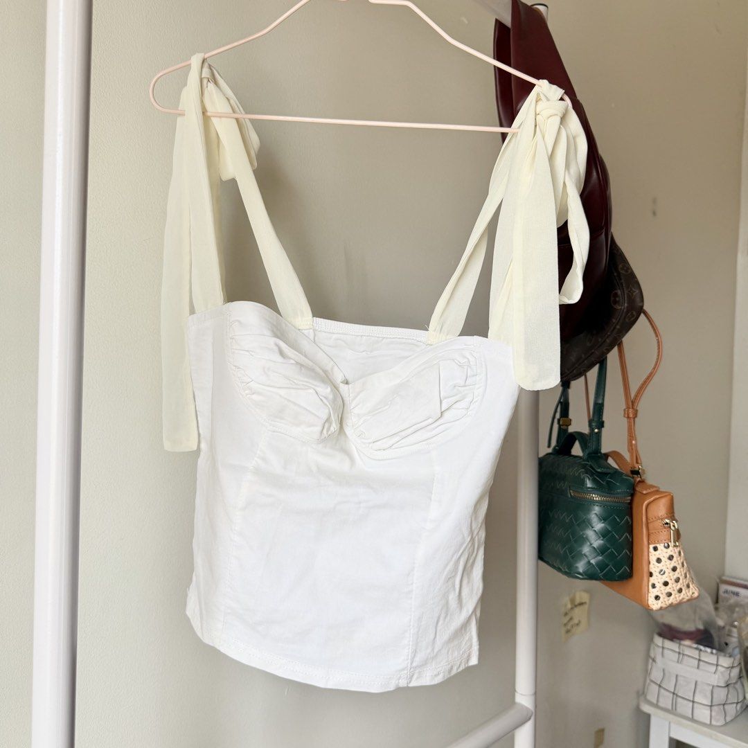 White Corset Bustier Top with Tie Straps (Category: Sleeveless) located in Cebu City. Submitted by mayanng_12 (Listing ID 1460346044, Image 1). Description: - Cute white corset top -small-med.