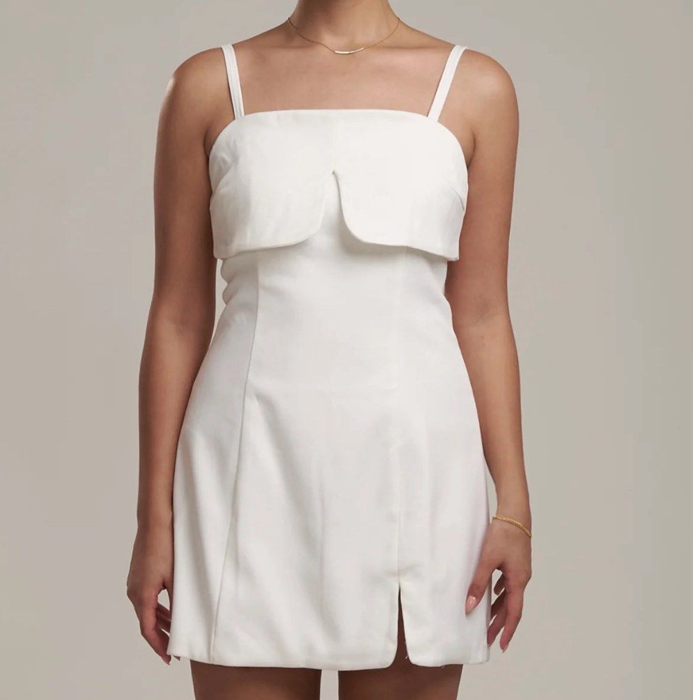 White mini dress (Category: Dresses) located in Manila. Submitted by prelovedby_lou (Listing ID 1460345135, Image 3). Description: - bought for 1,000 - never been worn - no issues - rfs: decluttering.
