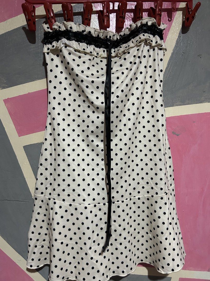 White Polka Dot Strapless Ruffle Dress (Category: Dresses) located in Manila. Submitted by prlvdbypau (Listing ID 1460397179, Image 2). Description: - Cute white dress with black polka dots - Strapless design with ruffled top edge - Ribbon tie detail down the front - Flared hemline - Ideal for a night out or party.