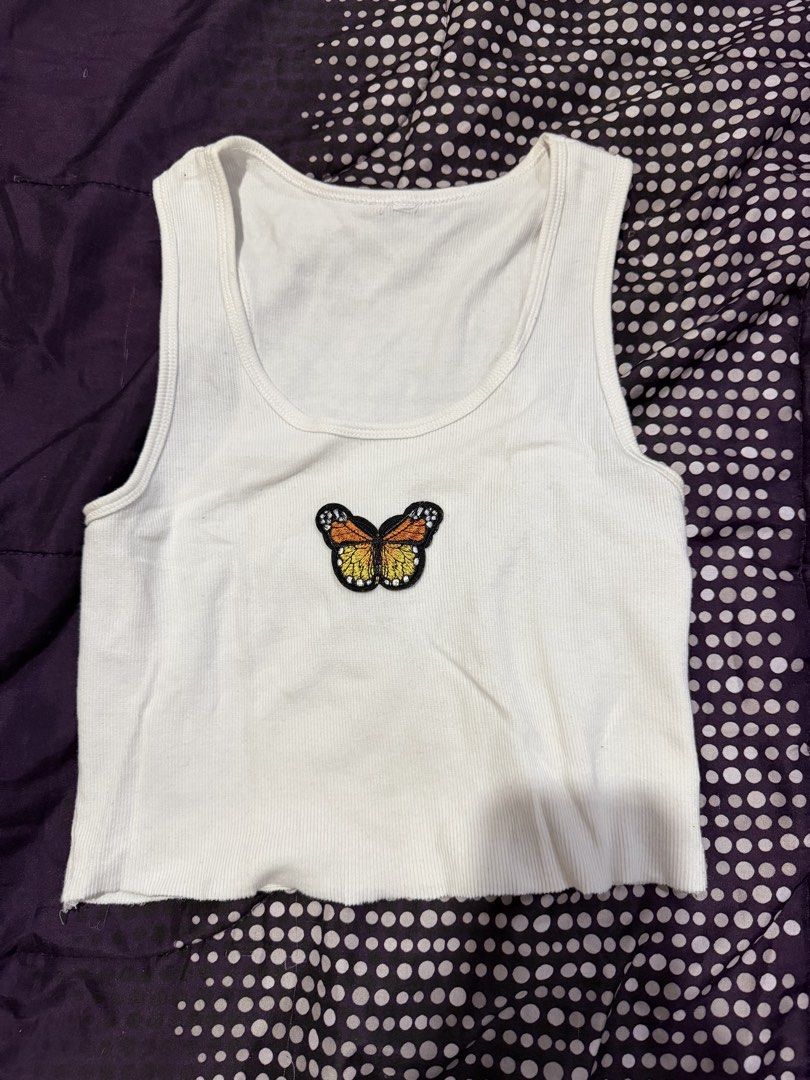 White tank top with butterfly patch medium to large (Category: Sleeveless) located in Taytay. Submitted by juliaddaa (Listing ID 1460408650, Image 1). Description: .