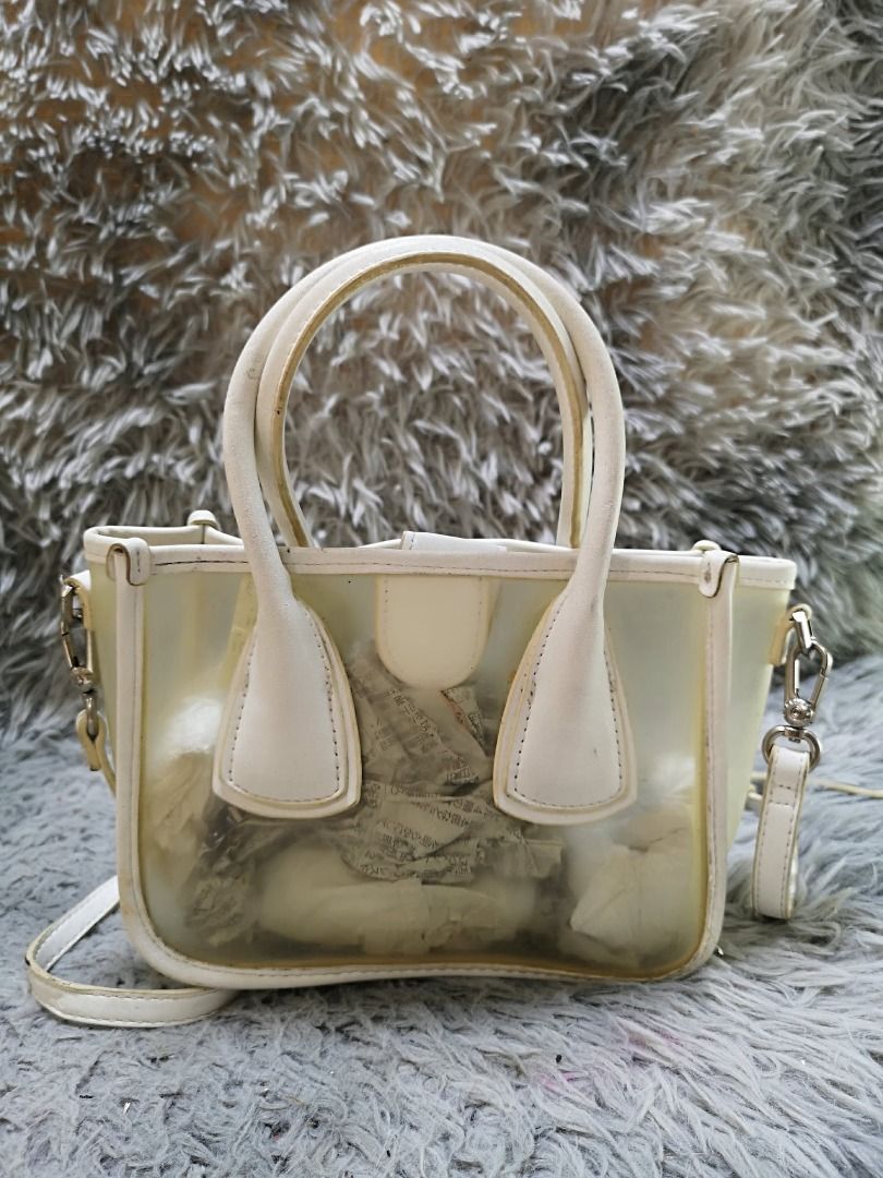 White Transparent Hand & Sling Bag (Category: Cross-body Bags) located in Santa Cruz. Submitted by jmy_surplus.2 (Listing ID 1460456850, Image 1). Description: Size ; L- 6 W - 10 Color ; White Type ; Hand & Sling Bag Brand ; No brand Material ; PVC Style ; White magnetic Snap Closure Hand & Sling bag LR 173 JMY 5 Batch #218.