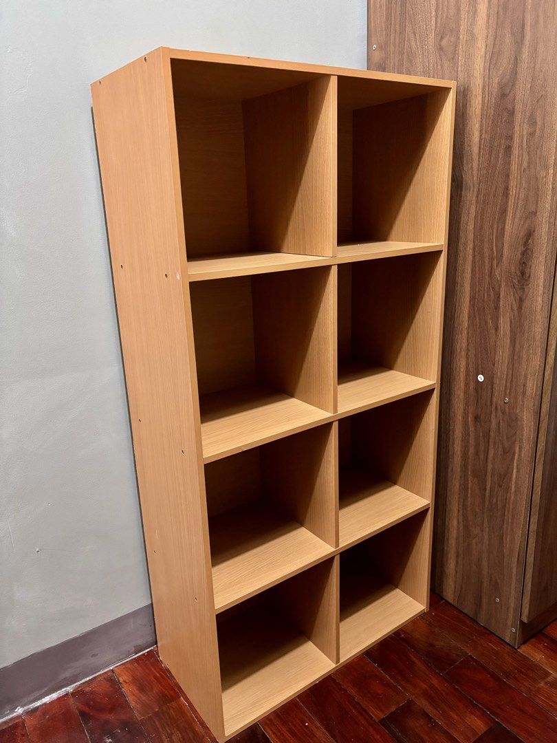 Wooden Bookshelf (Category: Shelves, Cabinets & Racks) located in Mandaluyong City. Submitted by trebron80 (Listing ID 1460342414, Image 2). Description: Hello friends - selling a sturdy wooden bookshelf. Can be used for books or toy display as seen in last picture. Dimensions - 62cm(W) × 29.5cm(D) x 124cm(H) Pickup/Delivery to be shouldered by buyer. Message me for faster transactions - thank you!.