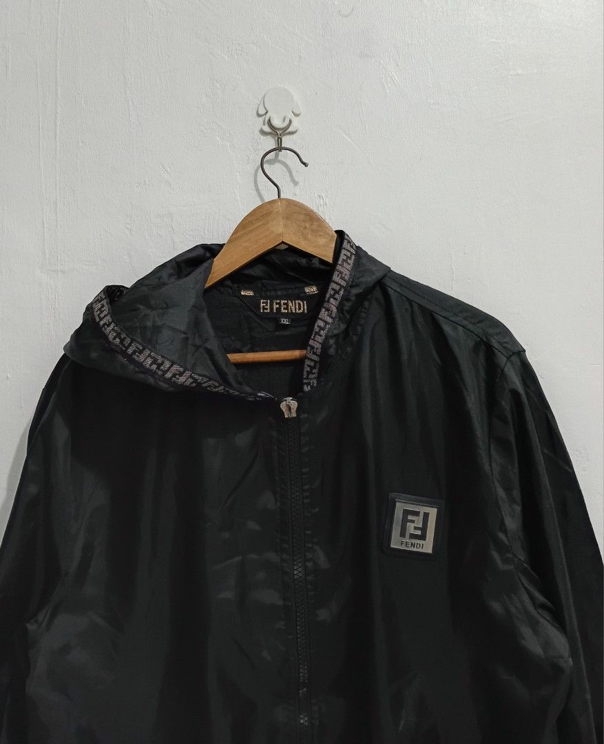 Y2K FENDI ZUCCA WINDBREAKER (Category: Luxury Apparel) located in Navotas City. Submitted by ms.soulana (Listing ID 1460414829, Image 2). Description: PREOWNED WellUsed Y2K Fendi ZUCCA Windbreaker /Rain Zip Jacket -black - Size: Large -Unisex - Features iconic FF monogram tape on hood, back, and cuffs - Includes Fendi FF Monogram Mini Crossbody Bag - Perfect set for any Fendi enthusiast - Please check photos for detailed condition Bought in Japan