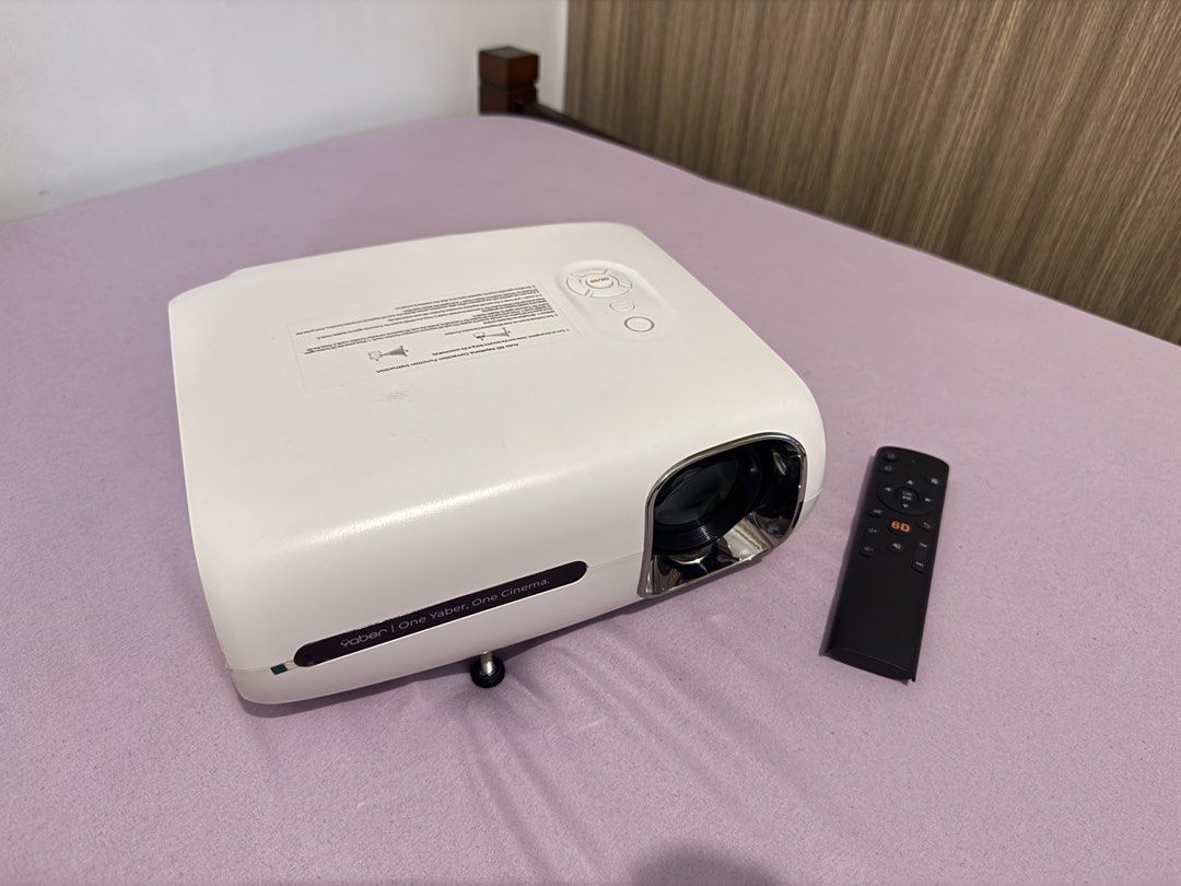 Yaber Pro V7 Entertainment Projector with Carry Bag (Category: Projectors) located in Manila. Submitted by s0398 (Listing ID 1460384772, Image 2). Description: - Yaber Pro V7 Projector - Includes: Carry bag, remote, cables, cleaning kit - Connectivity: HDMI, USB, AV ports - Ideal for: Movie nights, presentations - Features: Easy setup and use - All accessories shown are included.