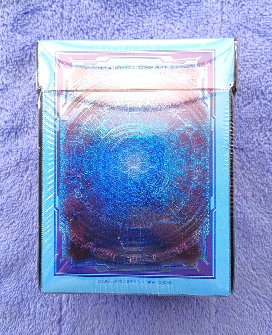 Yu-Gi-Oh Link Summon Special Duelist Card Case Deck Box (Sealed) (Category: Card Boxes & Cases) located in Iloilo. Submitted by jrmagallanes78 (Listing ID 1460328103, Image 3). Description: Official YuGiOh Prismatic Summon Duelist Deck Box with card divider (probably the thing shifting inside). Blue/light blue color scheme with holographic glitter effect on all sides. Items is still SEALED and UNUSED and in EXCELLENT condition with no readily vis