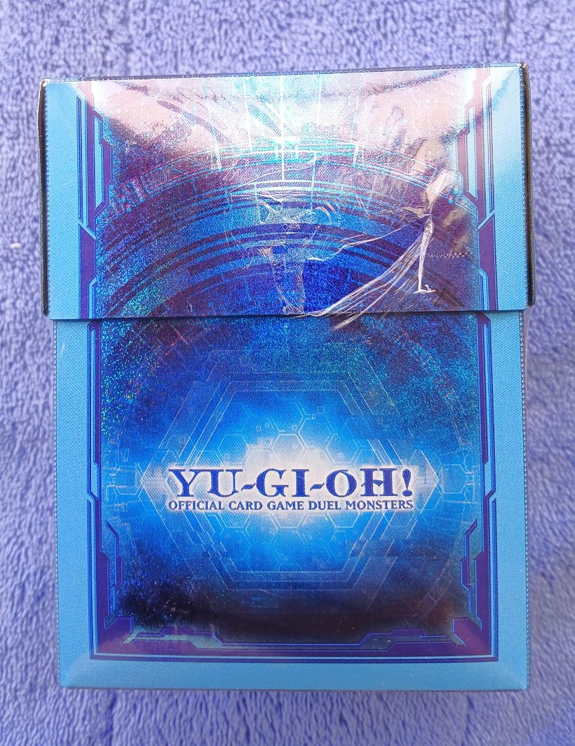 Yu-Gi-Oh Link Summon Special Duelist Card Case Deck Box (Sealed) (Category: Card Boxes & Cases) located in Iloilo. Submitted by jrmagallanes78 (Listing ID 1460328103, Image 2). Description: Official YuGiOh Prismatic Summon Duelist Deck Box with card divider (probably the thing shifting inside). Blue/light blue color scheme with holographic glitter effect on all sides. Items is still SEALED and UNUSED and in EXCELLENT condition with no readily vis
