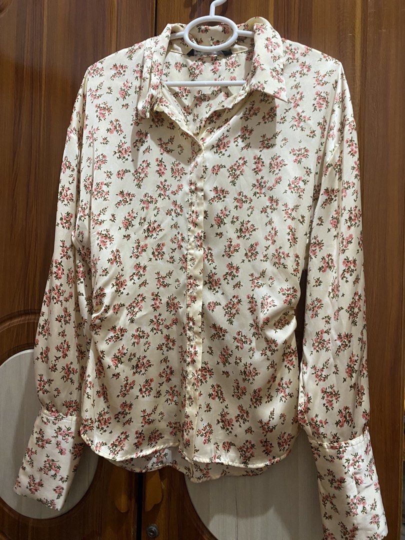 Zara Floral Print Button-Up Shirt (Category: Shirts) located in Dagupan City. Submitted by prelovedbybel_026 (Listing ID 1460426264, Image 1). Description: - Zara cream shirt with pink floral print - Long sleeves with button cuffs - Button-up front - Satin-like material - Versatile for dressing up or down.