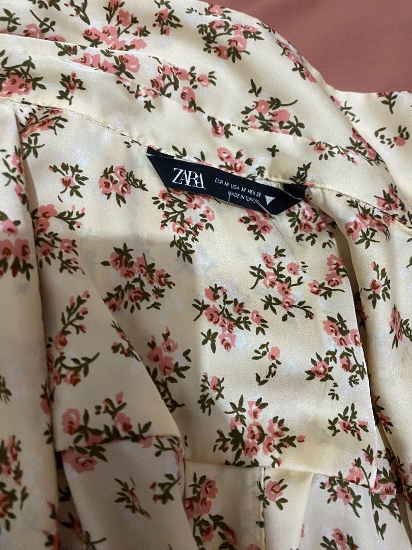 Zara Floral Print Button-Up Shirt (Category: Shirts) located in Dagupan City. Submitted by prelovedbybel_026 (Listing ID 1460426264, Image 2). Description: - Zara cream shirt with pink floral print - Long sleeves with button cuffs - Button-up front - Satin-like material - Versatile for dressing up or down.
