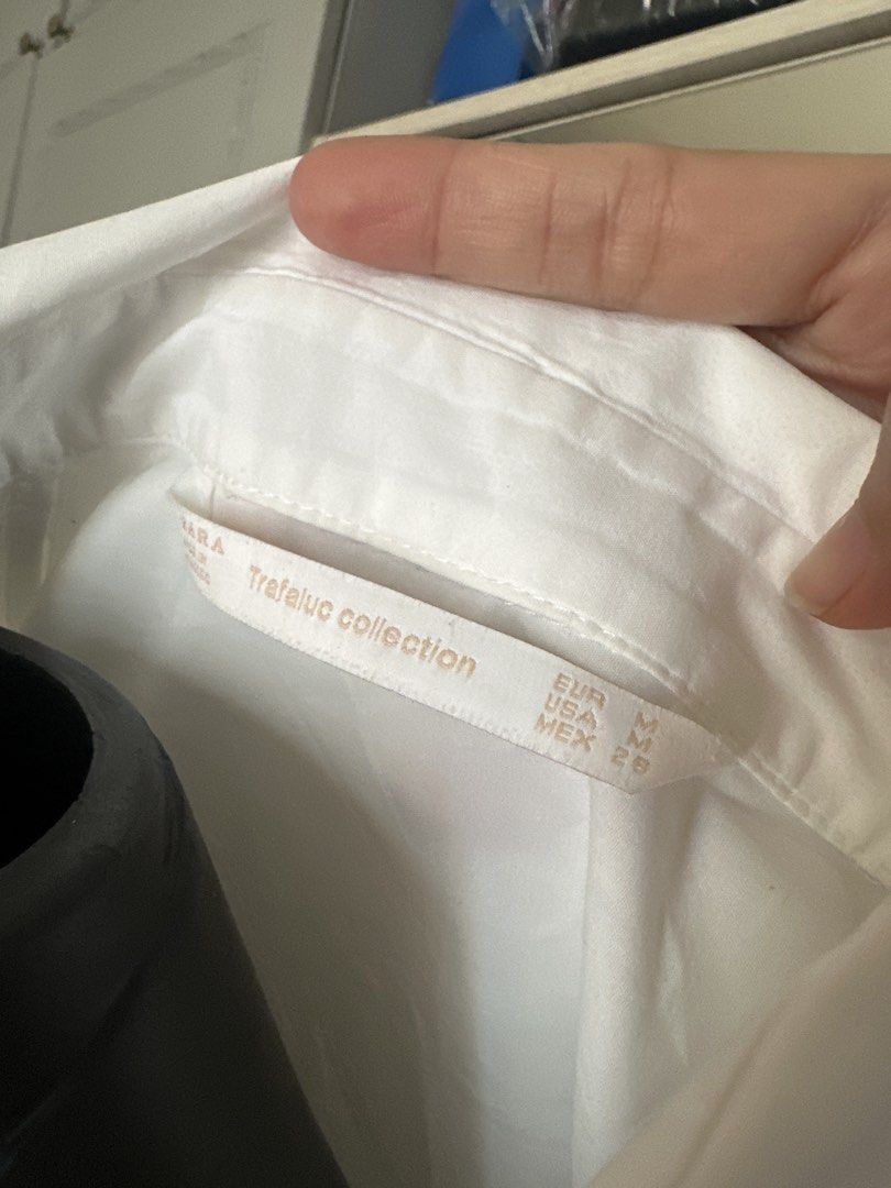 Zara White Short Sleeve Button Up Shirt Size M (Category: Shirts) located in Caloocan City. Submitted by 4mscloset (Listing ID 1460367236, Image 2). Description: - Zara Trafaluc White Short Sleeve Button-Up Shirt - Size: Medium (M) - Classic Fit - Versatile: Great for casual outfits or as a layering piece - Easy to style for various looks.