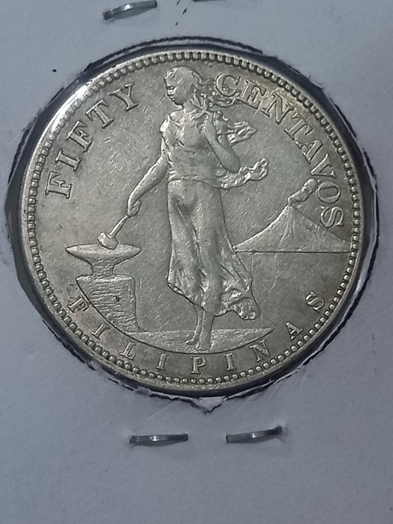 1919 Philippines 50 Centavos Coin (Category: Currency) located in Subic. Submitted by regiegabriel29 (Listing ID 1460520832, Image 1). Description: - Authentic 1919 Fifty Centavos Coin from the Philippines. - Features the iconic Lady Liberty on one side. - Reverse side displays an eagle with a shield. - A must-have addition for any coin collector. - Exhibits natural signs of age and handling, adding to its historical character. - in very good con