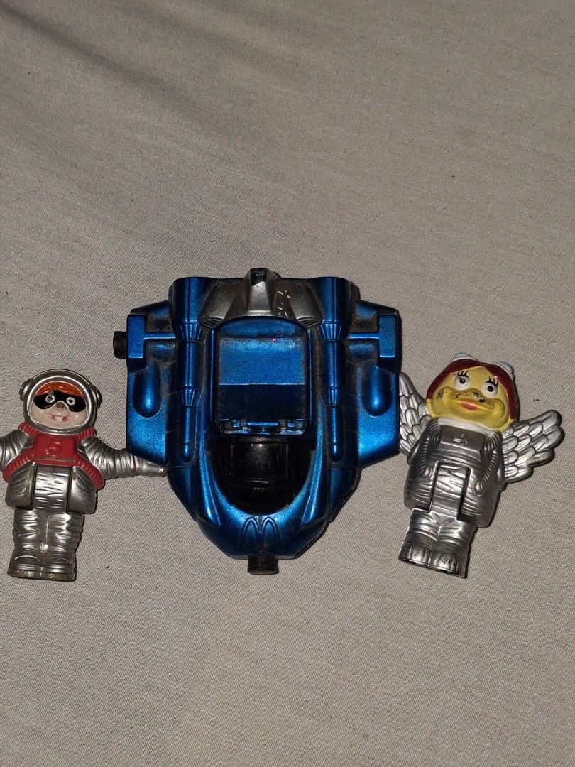2000 McDonald's Happy Meal Toy - Space Figures (Category: Character Goods) located in Manila. Submitted by marcas022798212 (Listing ID 1460618569, Image 3). Description: - Set of 2 McDonald's Happy Meal toys from the year 2000. - Includes a winged figure with a red helmet (McDonald's logo). - Includes an astronaut figure in a red suit and mask (McDonald's logo). - Both figures attach to a blue rocket vehicle with wheels. - Ideal for collectors or
