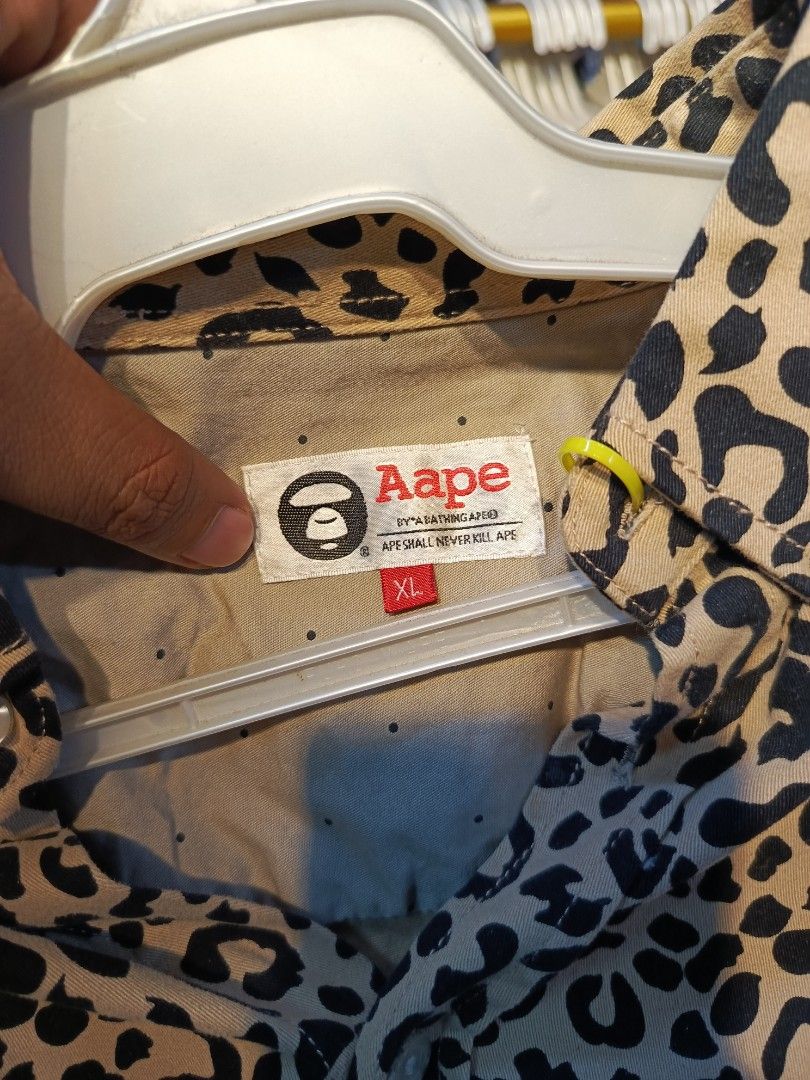AAPE BY A BATHING APE Leopard Print Button Down Shirt XL (Category: Tshirts & Polo Shirts ) located in Cabatuan. Submitted by penthegreat (Listing ID 1460648161, Image 3). Description: - Brand: AAPE BY A BATHING APE - Style: Button Down Shirt - Design: All-over Leopard Print - Material: 100% Cotton - Size: Tagged XL - Occasion: Casual Wear - Condition: Please check photos for details.