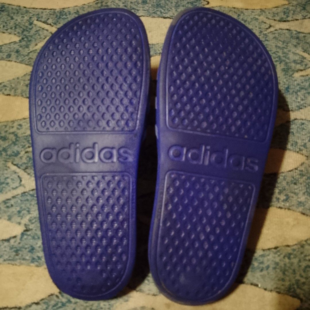 Adidas Adilette Shower Slides (Category: Flats & Sandals) located in Antipolo. Submitted by jomavi20 (Listing ID 1460596266, Image 3). Description: - Classic Adidas slides - Iconic three-stripe design on strap - Adidas logo featured on sole - Ideal for casual wear or after sports - Comfortable and easy slip-on design.