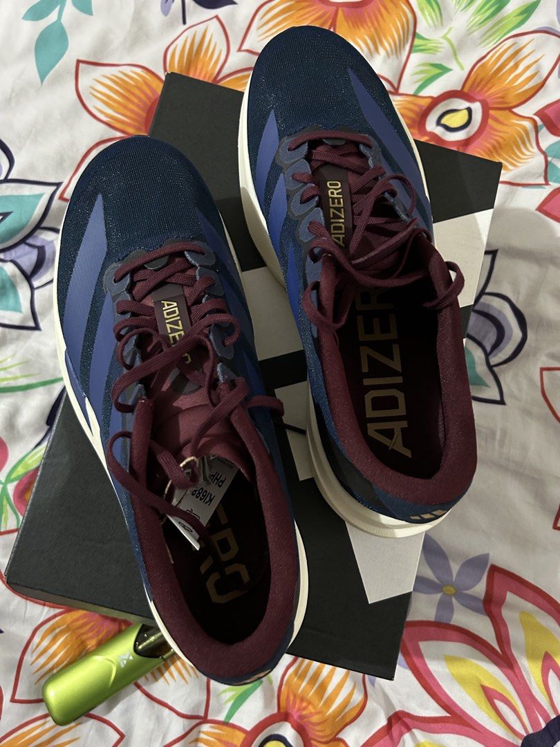 Adidas Adizero Evo SL (Category: Sneakers) located in Quezon City. Submitted by theeshoppe (Listing ID 1460535233, Image 2). Description: 100% Authentic Bnew with tags and original box Purchased from Foot Locker UPTC Can provide the purchase receipt Size: US 8 / UK 7.5 (please refer to Adidas sizing) Colorway: Co Navy/Maroon RFS: Wrong size Price is slightly negotiable.