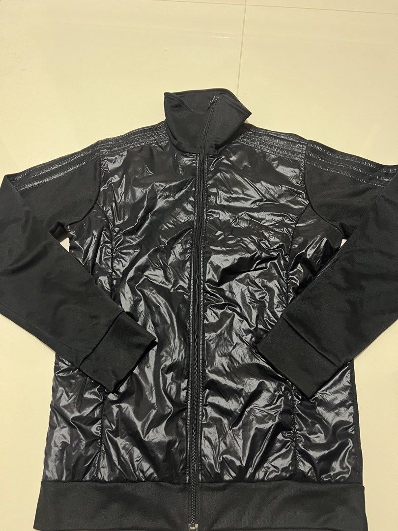 Adidas Black Shiny Puffer Track Jacket (Category: Coats, Jackets and Outerwear) located in Lapu Lapu. Submitted by chelon.865 (Listing ID 1460700654, Image 1). Description: - Black Adidas track jacket - Shiny puffer front with black sleeves and collar - Full zip closure - Adidas logo on zipper pull and inside tag - Made in China - Size 100 - Perfect for casual wear or sports.