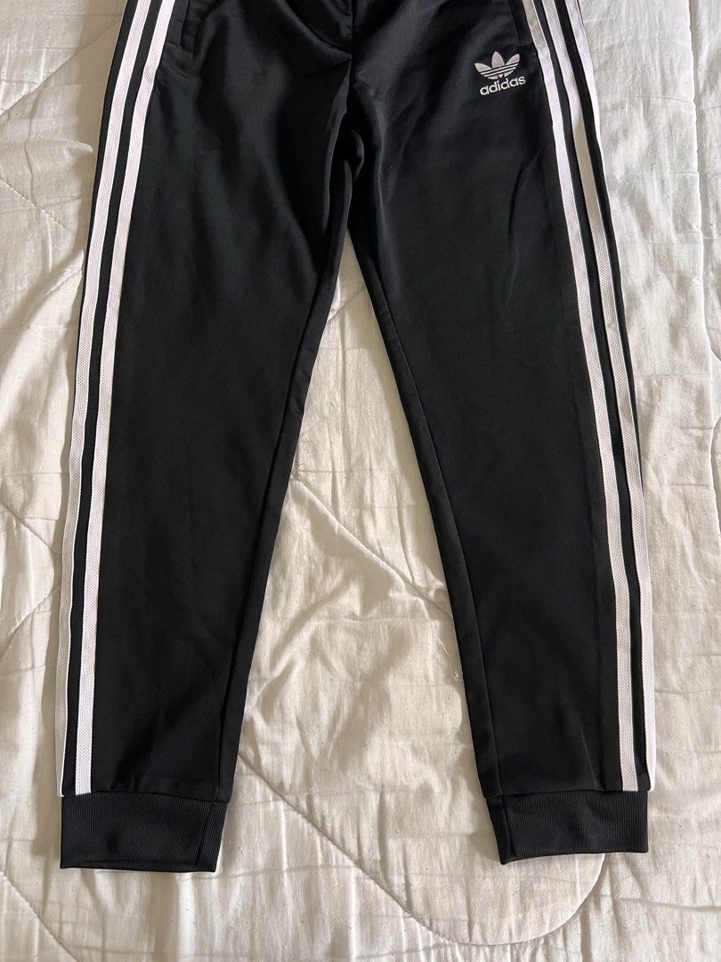 Adidas Black Striped Track Pants (Category: Other Bottoms) located in Taguig. Submitted by gingerderp (Listing ID 1460571255, Image 3). Description: Never worn Adidas track pants that are so comfortable and versatile! Can easily give you a sporty look!.