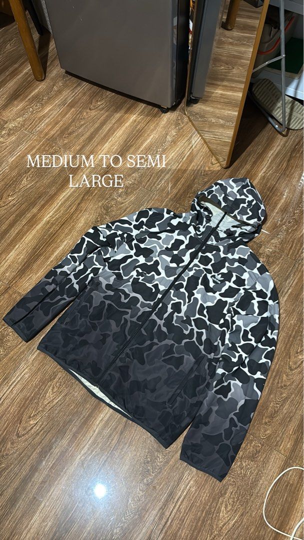 Adidas Camo Hooded Jacket Medium to Semi Large (Category: Coats, Jackets and Outerwear) located in Batangas. Submitted by franzbucal (Listing ID 1460658225, Image 1). Description: - Stylish Adidas jacket with a cool camo print that fades to black. - Features a convenient hood and zip-up front. - Fits like a medium or a semi-large, offering a comfortable wear. - Ideal for casual outings or light outdoor activities. - Feel free to ask any questions