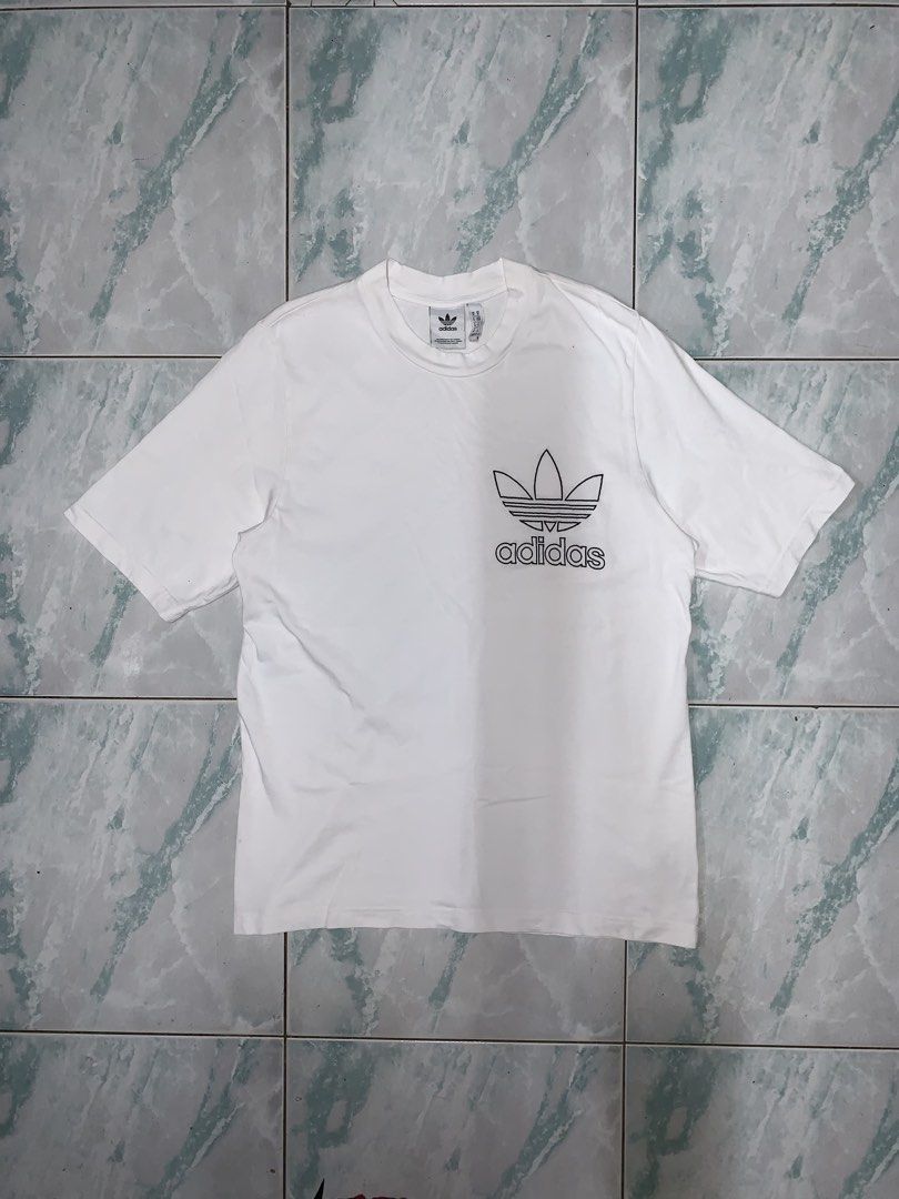Adidas embroidered tee (Category: Tshirts & Polo Shirts ) located in Pasig City. Submitted by thriftnflip1600 (Listing ID 1460546366, Image 1). Description: M on tag Width: 21” Length: 30” Color rate: 9+/10 Condition: 9+/10 No issues.
