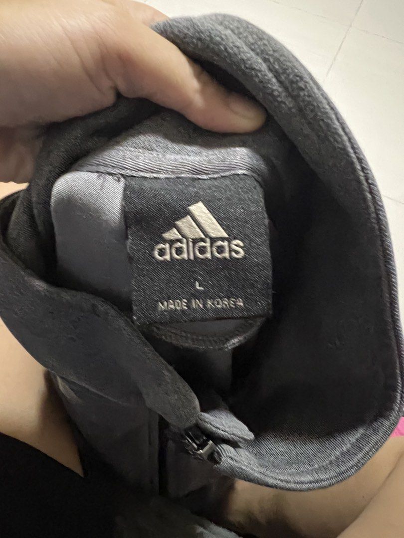 Adidas Grey Track Jacket Size L (Category: Coats, Jackets and Outerwear) located in Lapu Lapu. Submitted by chelon.865 (Listing ID 1460700590, Image 2). Description: - Grey Adidas track jacket - Full zip closure - Zippered pockets - Adidas logo on sleeve - Made in Korea - Size L - Ideal for workouts or casual wear.