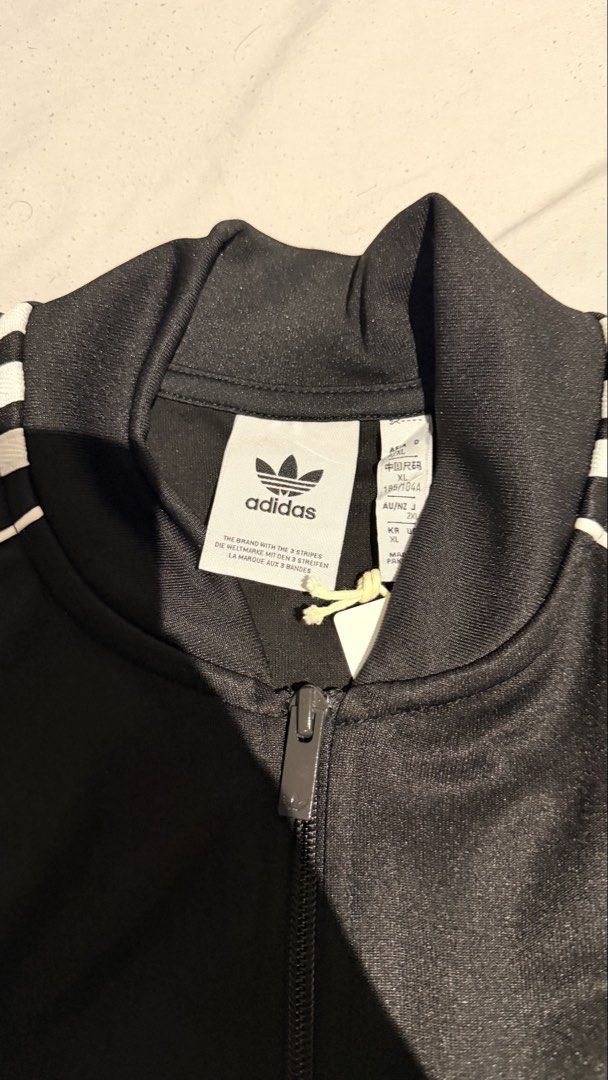 Adidas Track Jacket (Category: Coats, Jackets and Outerwear) located in San Mateo. Submitted by arkithhh (Listing ID 1460690337, Image 2). Description: Adidas track jacket Mens size fits M-L Womens size fit L-XL Like new with tags .