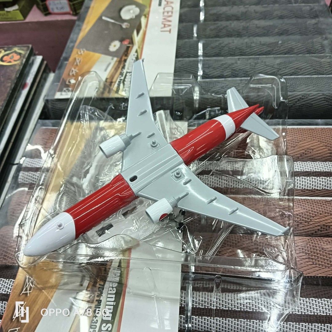 AirAsia Airplane Model Toy (Category: Vehicle & Diecast Models) located in Manila. Submitted by iliasjen3082126 (Listing ID 1460568895, Image 3). Description: - Die-cast AirAsia airplane model - Iconic red and white livery with 'airasia.com' branding - Brand new in original plastic packaging - Approximately 15cm in length - Ideal for collectors or display.