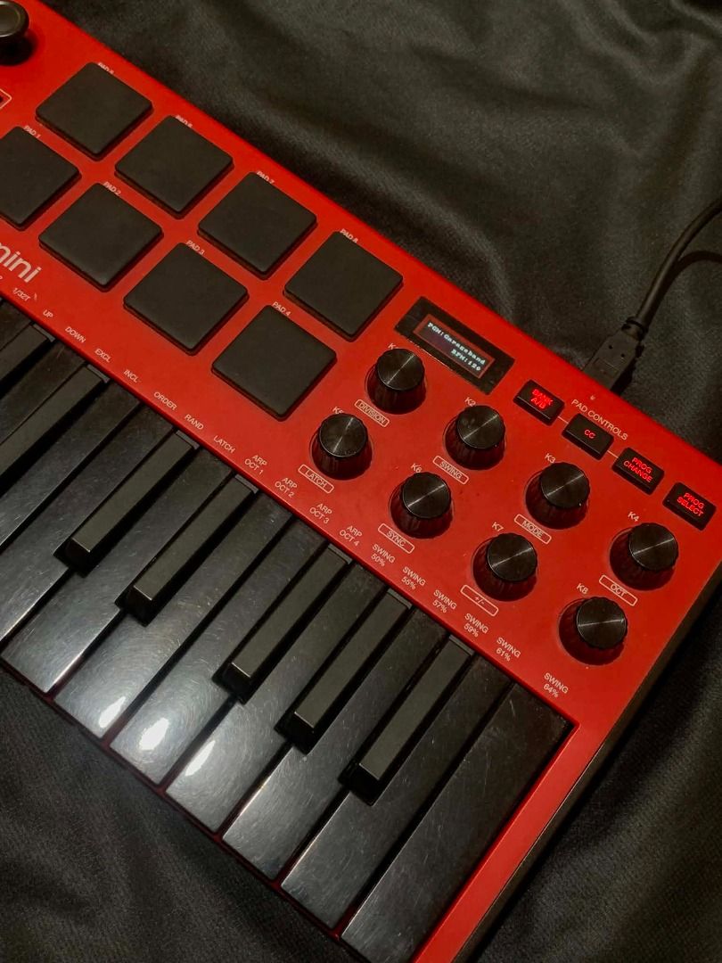 AKAI MPK mini Red MIDI Controller Keyboard (Category: Musical Instruments) located in Limay. Submitted by rustictwist (Listing ID 1460512980, Image 3). Description: 🎹 AKAI MPK Mini – Black & Red - Red AKAI MPK mini MIDI controller - Compact and portable for on-the-go beat making - Includes keys and drum pads - All knobs and buttons are present and functional - In good working condition - Comes with USB cable ✨Negotiable ✨ 📦 Shipping: LBC or J&T