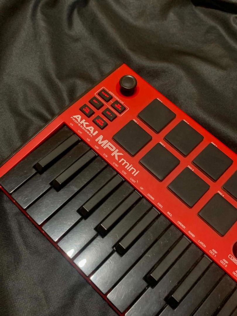 AKAI MPK mini Red MIDI Controller Keyboard (Category: Musical Instruments) located in Limay. Submitted by rustictwist (Listing ID 1460512980, Image 2). Description: 🎹 AKAI MPK Mini – Black & Red - Red AKAI MPK mini MIDI controller - Compact and portable for on-the-go beat making - Includes keys and drum pads - All knobs and buttons are present and functional - In good working condition - Comes with USB cable ✨Negotiable ✨ 📦 Shipping: LBC or J&T