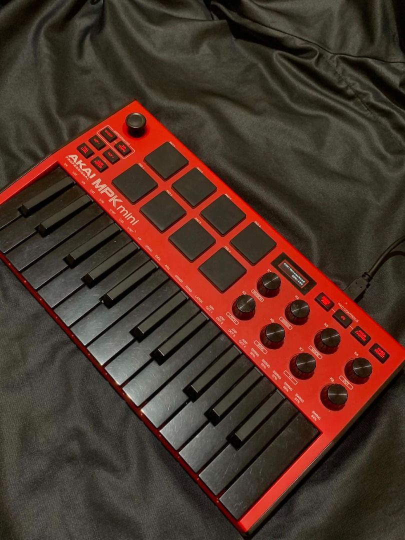 AKAI MPK mini Red MIDI Controller Keyboard (Category: Musical Instruments) located in Limay. Submitted by rustictwist (Listing ID 1460512980, Image 1). Description: 🎹 AKAI MPK Mini – Black & Red - Red AKAI MPK mini MIDI controller - Compact and portable for on-the-go beat making - Includes keys and drum pads - All knobs and buttons are present and functional - In good working condition - Comes with USB cable ✨Negotiable ✨ 📦 Shipping: LBC or J&T