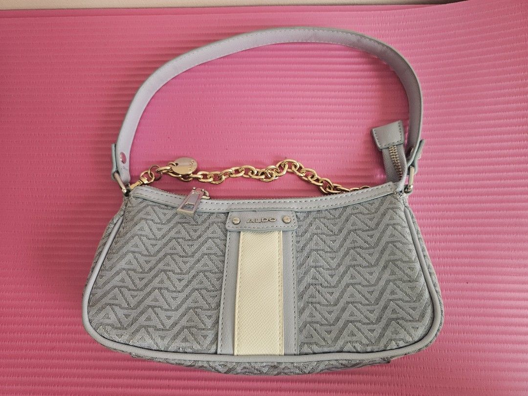 ALDO Light Blue Monogram Shoulder Bag with Gold Chain (Category: Shoulder Bags) located in Manila. Submitted by czarinajadeee (Listing ID 1460580597, Image 1). Description: - Cute light blue ALDO shoulder bag - All-over ALDO monogram pattern - Gold chain detail and single strap - Zipper closure - Cream and grey stripe detail on the front - Great for everyday use.