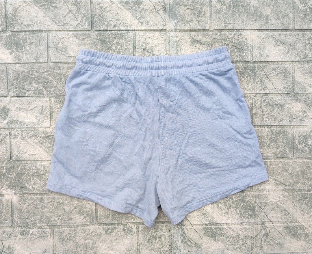 Alexander Wang T Light Blue Sequin Logo Sweat Shorts (Category: Shorts) located in Bayambang. Submitted by mon10192816 (Listing ID 1460681086, Image 2). Description: - Waist 29-33 - Length 13.5 - Issue small stain on back check last photo - Alexander Wang T. light blue sweat shorts - Features brand logo with sequin details on the side - Elastic waistband with drawstring - Made in Portugal - 100% Cotton.