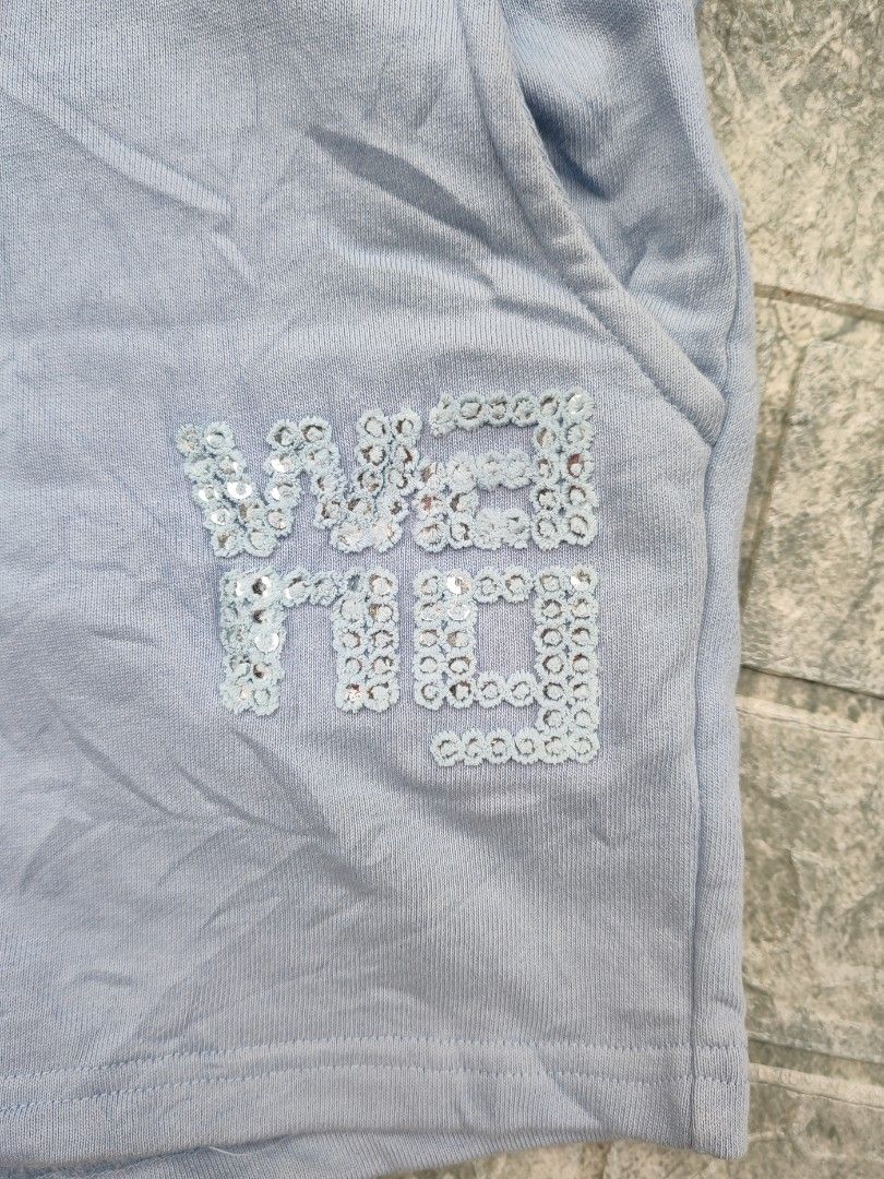 Alexander Wang T Light Blue Sequin Logo Sweat Shorts (Category: Shorts) located in Bayambang. Submitted by mon10192816 (Listing ID 1460681086, Image 3). Description: - Waist 29-33 - Length 13.5 - Issue small stain on back check last photo - Alexander Wang T. light blue sweat shorts - Features brand logo with sequin details on the side - Elastic waistband with drawstring - Made in Portugal - 100% Cotton.