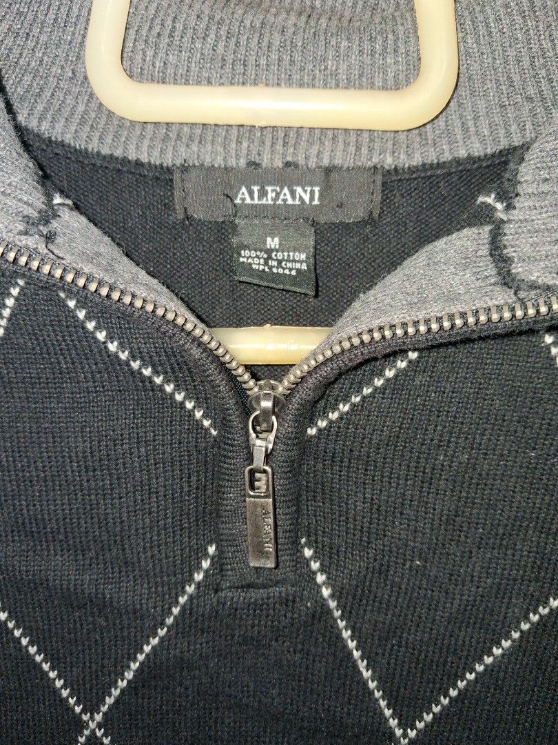 Alfani Black & Grey Argyle Quarter Zip Sweater (Category: Coats, Jackets and Outerwear) located in Baguio. Submitted by arowarwai (Listing ID 1460664890, Image 2). Description: - Alfani Quarter Zip Sweater - Color: Black with Grey Argyle Pattern - Size: Medium - Material: 100% Cotton - Versatile: Great for layering or wearing on its own - Style: Comfortable and stylish.
