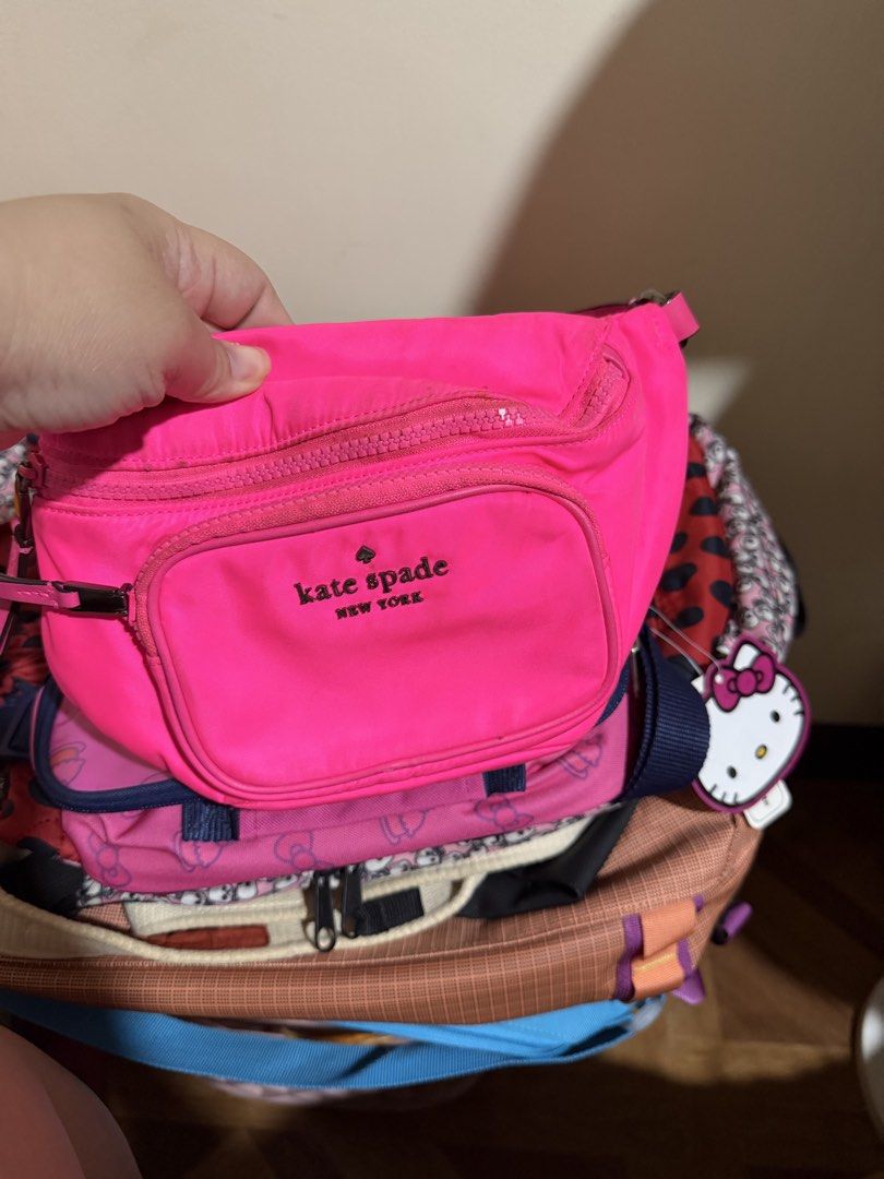 assorted branded bags (Category: Cross-body Bags) located in Manila. Submitted by ambercs (Listing ID 1460610776, Image 2). Description: auth bags read first prices of each are listed below 1. benetton duffle bag = 1,500 2. kate spade pink belt bag= 2,000 ( dirt and minor rubs) 3. marc jacobs tote bag= 1k 4. segue bag ( adjustable strap, like new ) = 900.
