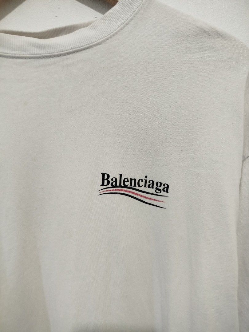 Authentic Balenciaga Logo T-Shirt (Category: Tshirts & Polo Shirts ) located in Abucay. Submitted by ukay_withdj (Listing ID 1460513312, Image 3). Description: - Authentic Balenciaga T-shirt - Color: White - Size: S - Features iconic wavy logo on both front and back - Made in Portugal - Ideal for everyday casual wear.