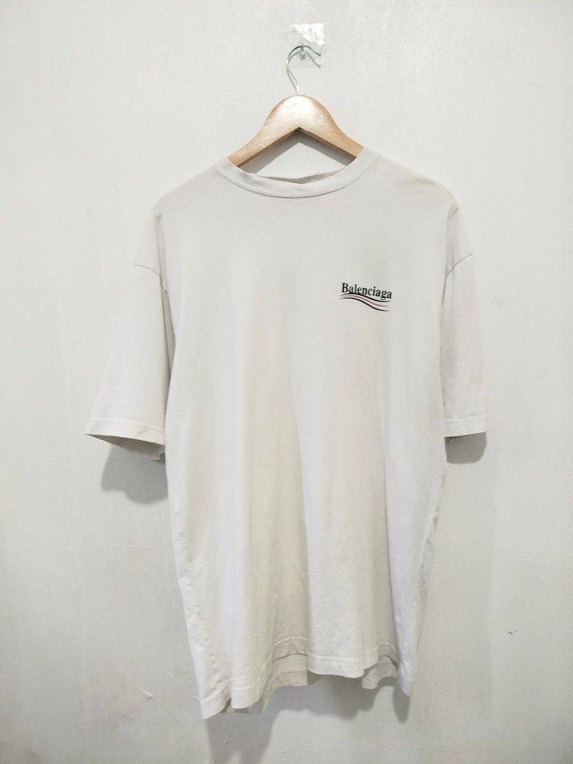 Authentic Balenciaga Logo T-Shirt (Category: Tshirts & Polo Shirts ) located in Abucay. Submitted by ukay_withdj (Listing ID 1460513312, Image 1). Description: - Authentic Balenciaga T-shirt - Color: White - Size: S - Features iconic wavy logo on both front and back - Made in Portugal - Ideal for everyday casual wear.