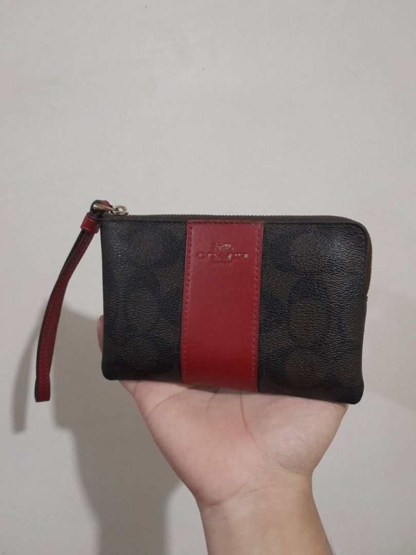 Authentic Coach Corner Zip Wristlet (Category: Wallets & Card holders) located in Manila. Submitted by matchalattelxver (Listing ID 1460568414, Image 1). Description: with price tag and care card. only issue is fade logo. still good condition, smooth zipper, no scratches. slightly negotiable! Manila📍.