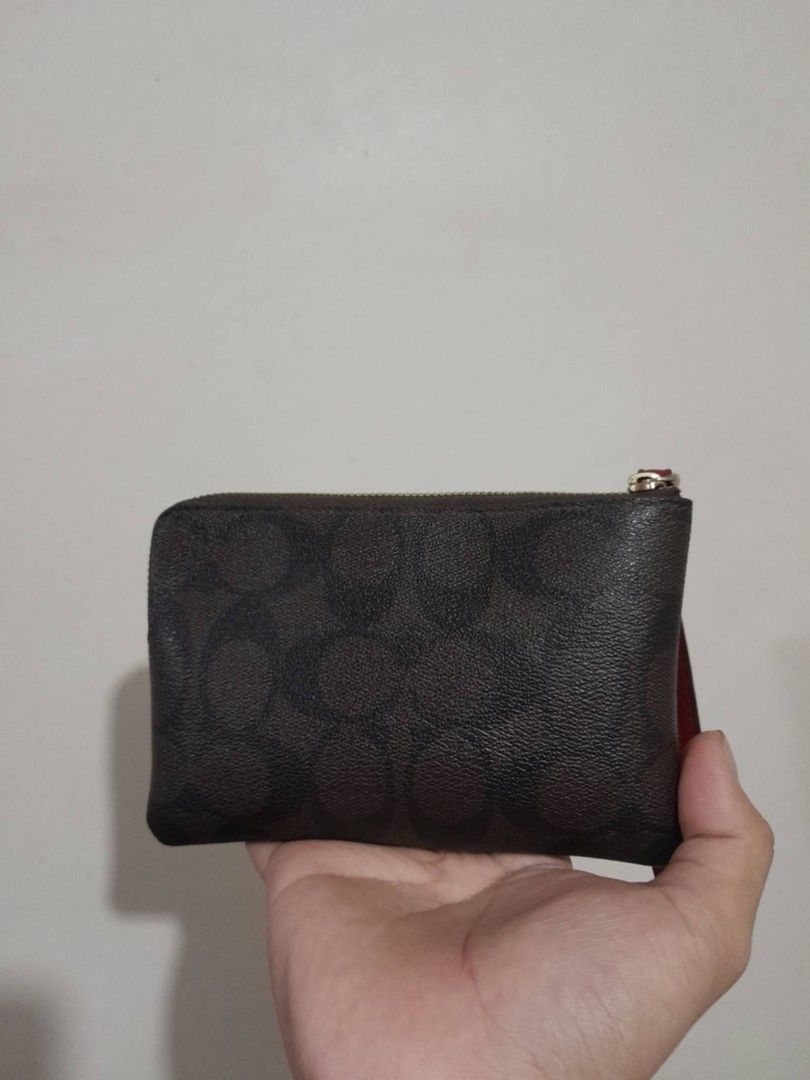 Authentic Coach Corner Zip Wristlet (Category: Wallets & Card holders) located in Manila. Submitted by matchalattelxver (Listing ID 1460568414, Image 3). Description: with price tag and care card. only issue is fade logo. still good condition, smooth zipper, no scratches. slightly negotiable! Manila📍.