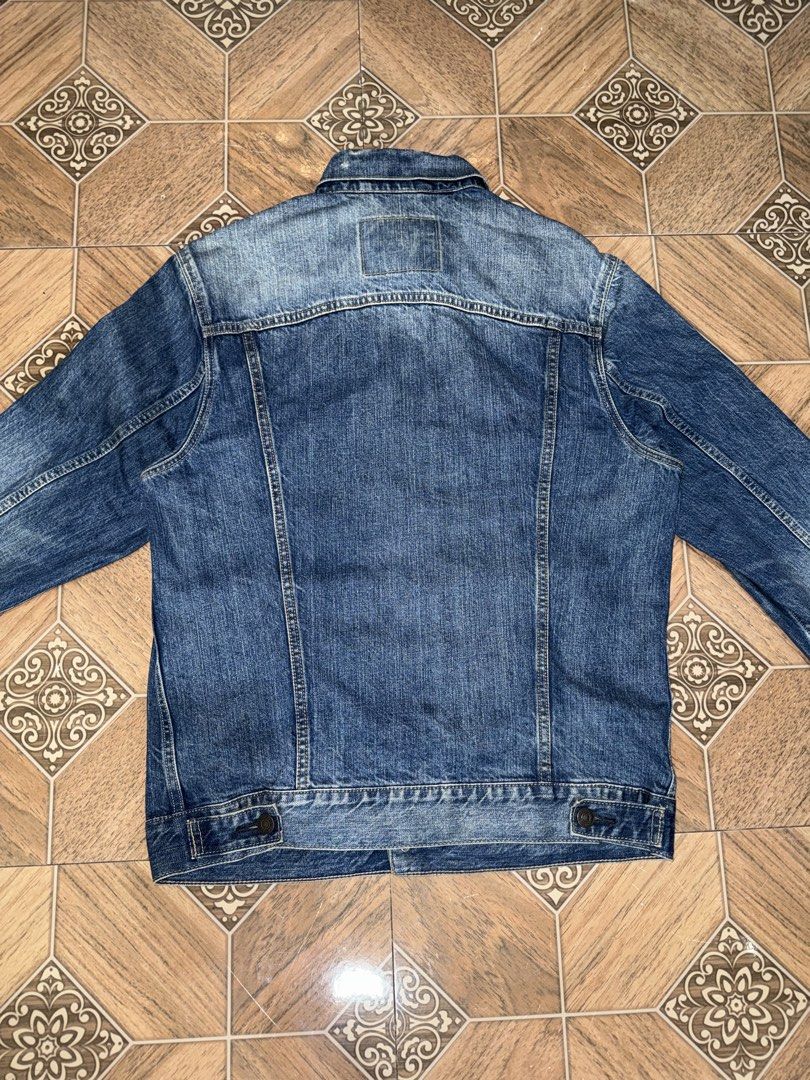 Authentic Levi's Denim Trucker Jacket Size Medium (Category: Coats, Jackets and Outerwear) located in Taguig. Submitted by jayveealfaro12 (Listing ID 1460536156, Image 2). Description: Authentic Levi’s Classic Denim Trucker Jacket in a washed blue finish. Timeless piece that pairs easily with any streetwear or vintage fit. Size: Medium (Men’s) Condition: 8/10 — Normal signs of wear. Has minor fraying/distressing on the inside collar band (see pho