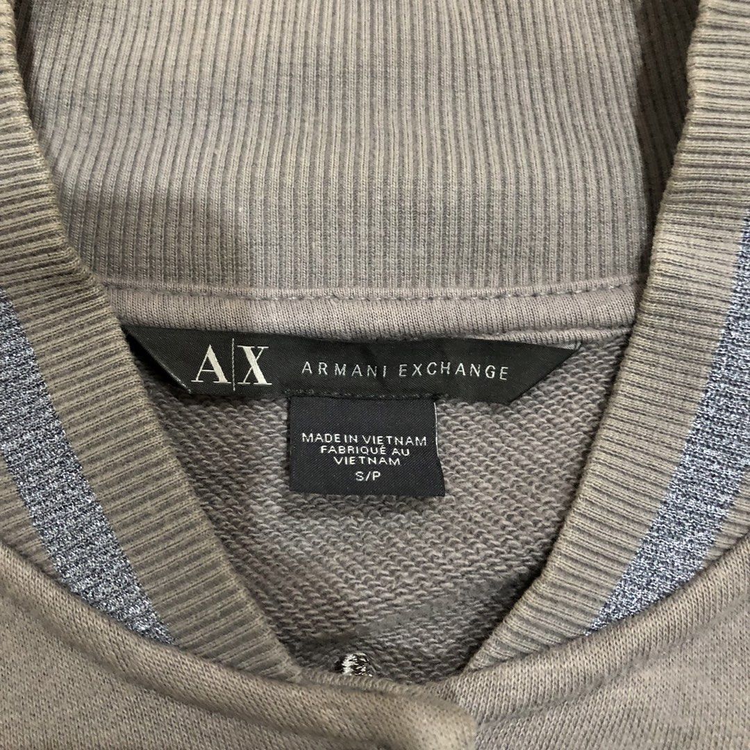 AX Armani Exchange Jacket S (Category: Coats, Jackets and Outerwear) located in Quezon City. Submitted by high1sthrift (Listing ID 1460634917, Image 2). Description: FOR SALE: A|X ARMANI EXCHANGE VARSITY S ₱750 MEASUREMENTS: W16 L22 - Fitted Color: Gray | 9/10 Condition Authentic | Made in Vietnam Big logo sa likod 🔥 QC loc. Ship nationwide PM to mine 💬.