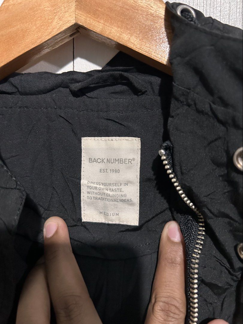 BACK NUMBER Black Hooded Jacket Medium (Category: Coats, Jackets and Outerwear) located in Tuguegarao City. Submitted by thrift_ni_boy (Listing ID 1460537134, Image 2). Description: - Brand: BACK NUMBER - Type: Hooded Jacket - Color: Black - Size: Medium (M) - Features: Drawstrings on hood and hem, two front pockets - Closure: Zipper with snap button overlay - Style: Great for layering.