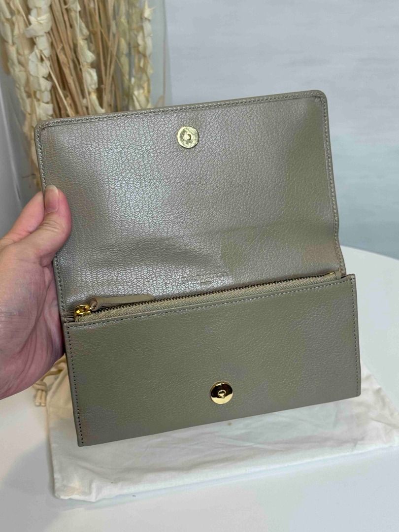 Balenciaga Grey Leather Zip Around Wallet (Category: Luxury Bags & Wallets) located in Las Pinas. Submitted by happystar_cac724 (Listing ID 1460600788, Image 2). Description: - Authentic Balenciaga wallet in stylish grey leather. - Elegant gold hardware accents. - Secure zip-around closure. - Interior features multiple card slots and compartments for excellent organization. - Comes with original dust bag. - Perfect for keeping your essentials tid